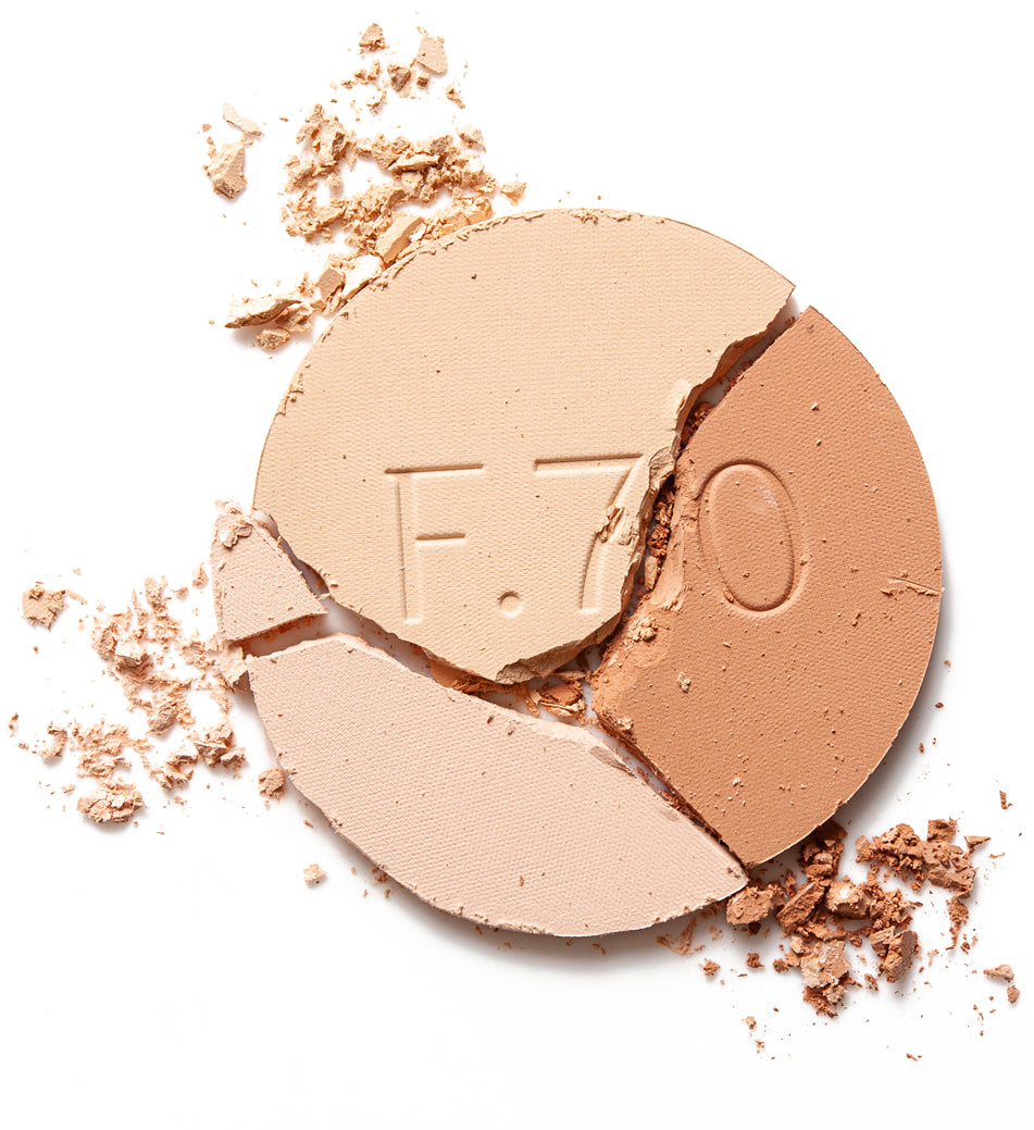 Face powders cracked open to reveal colorful dust