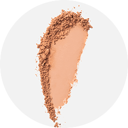 Swatch of finishing powder in warm apricot and beige hue