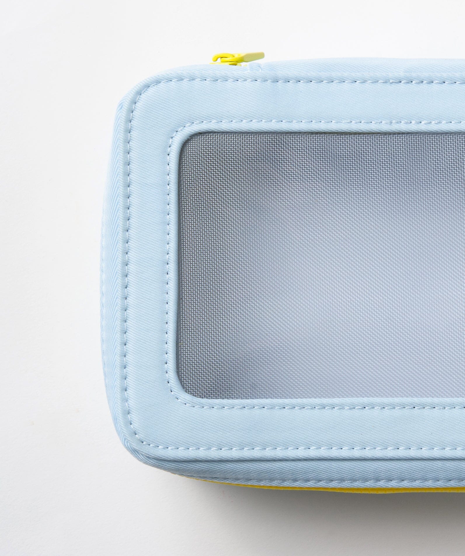 Top view of pale blue vanity case with see-through window